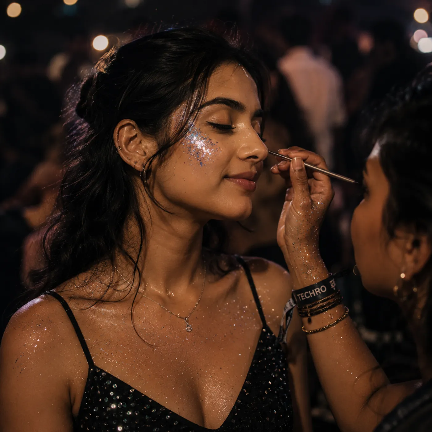 Complimentary face glitter being applied at TechRo